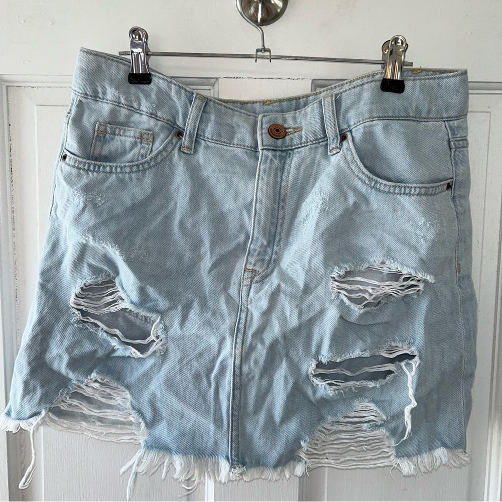 4 for $20 Divided light wash distressed/ripped denim skirt